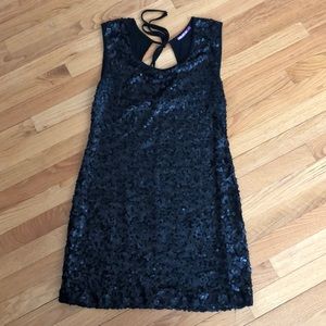 Black sequinned cocktail dress.